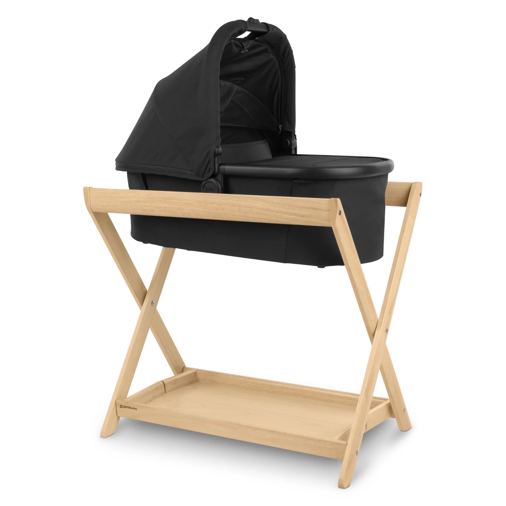 UPPAbaby carrycot bassinet with canopy on wooden stand in natural finish, studio product image.