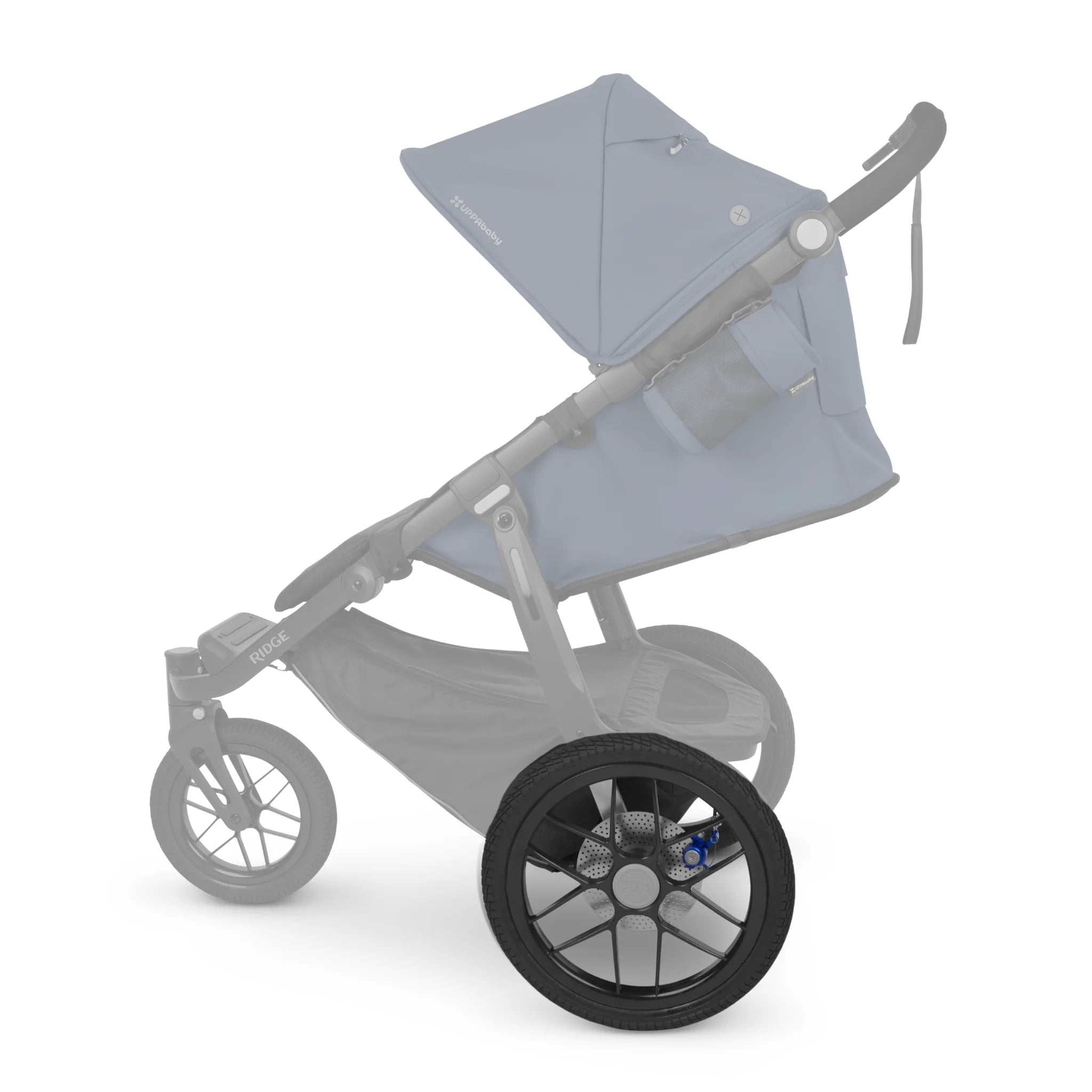 Close-up of a replacement rear wheel installed on a UPPAbaby Ridge jogging stroller, with the highlighted black wheel shown in focus and the rest of the stroller faded against a white background.