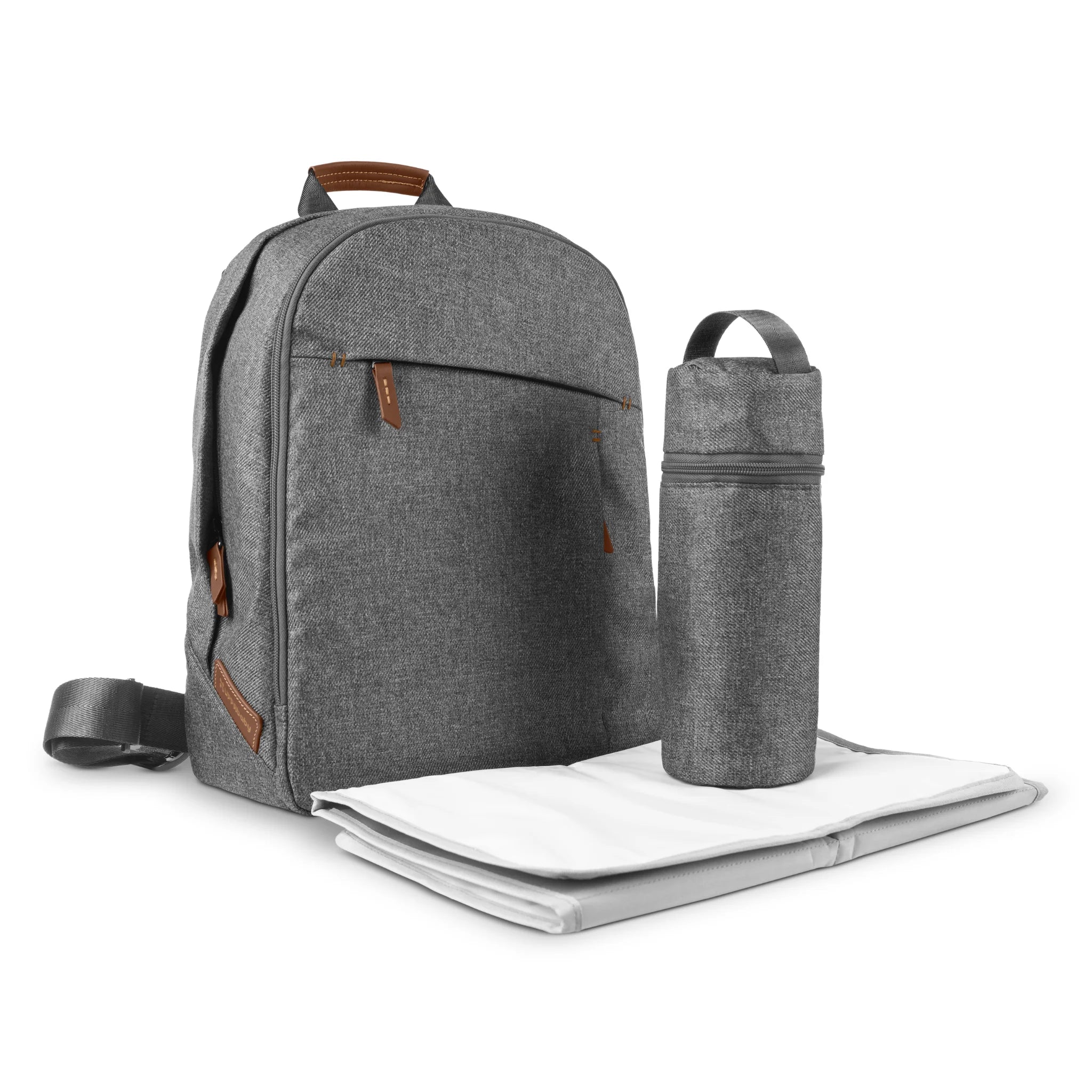 Grey UPPAbaby Changing Backpack (Greyson) with brown leather accents, shown alongside a matching insulated bottle holder and a foldable changing pad on a white background.