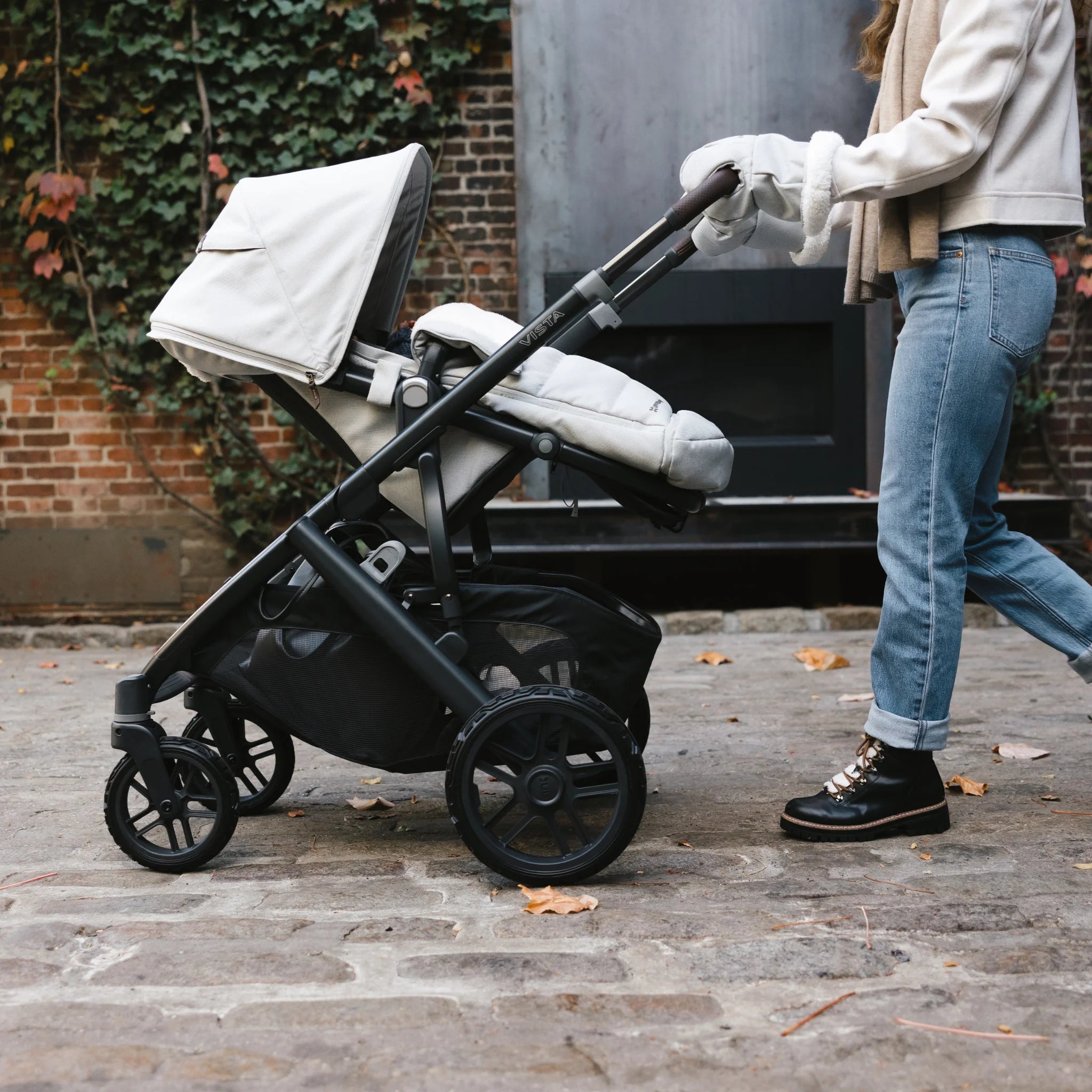 Mum pushing vista buggy with all terrain wheels outside.