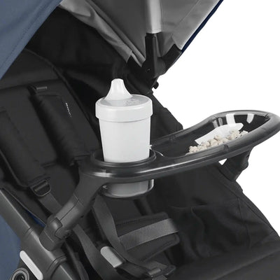 Stroller snack tray with cup holder and toddler snack compartment attached to pram for easy family travel and on-the-go feeding