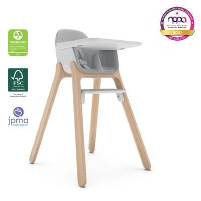 Ciro high chair in light grey with natural wood legs and white tray, on a white background with certification and award logos