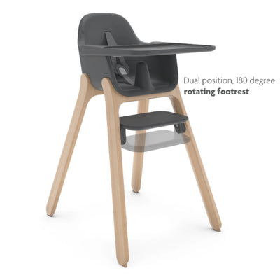 UPPAbaby Ciro high chair in Jake (dark gray) with light wood legs, showing the dual-position 180° rotating footrest.