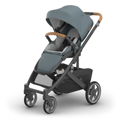 UPPAbaby Cruz single pram in Dillan with newborn insert on white background.