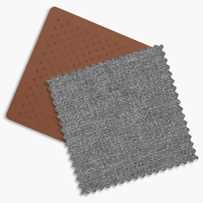 Close up of the saddle leather and the charcoal melange fabrics of the Greyson fashion.