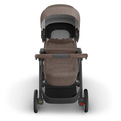 Front view of the UPPAbaby Cruz V3 stroller with the Infant Cover in Owen, showing the chestnut brown fabric canopy, protective infant cover and full stroller frame.
