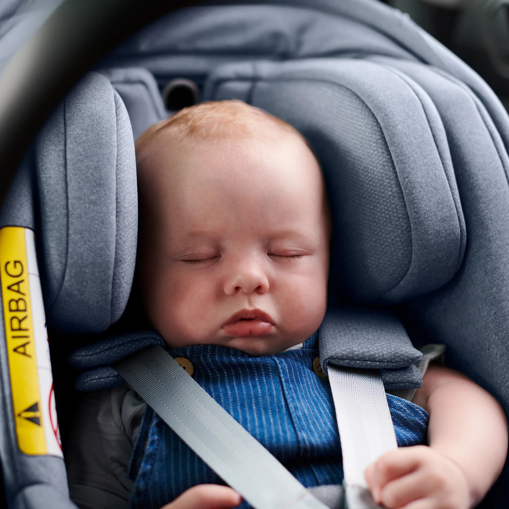 Baby sleeping in Gregory Mesa car seat in newborn mode.