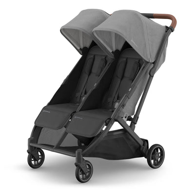 Lightweight side-by-side stroller in grey on white backgorund.