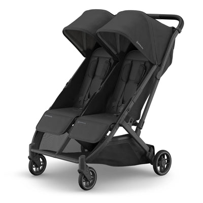 All black side-by-side pram on white background.