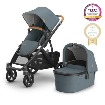 Vista V3 buggy in Dillan with carrycot next to it on a white background with gold awards logos.