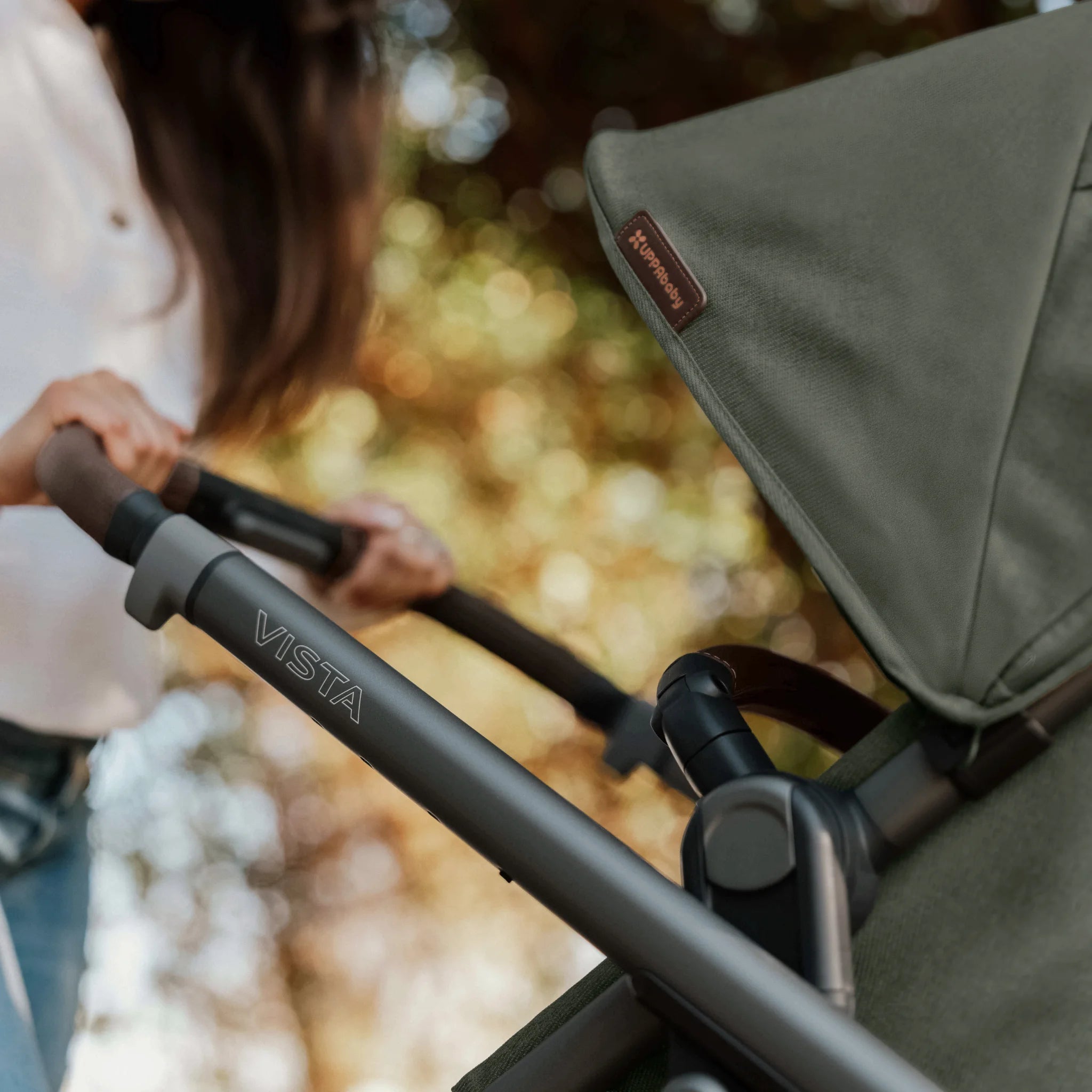 Close-up of a Vista stroller in Evelyn with a blurred natural background