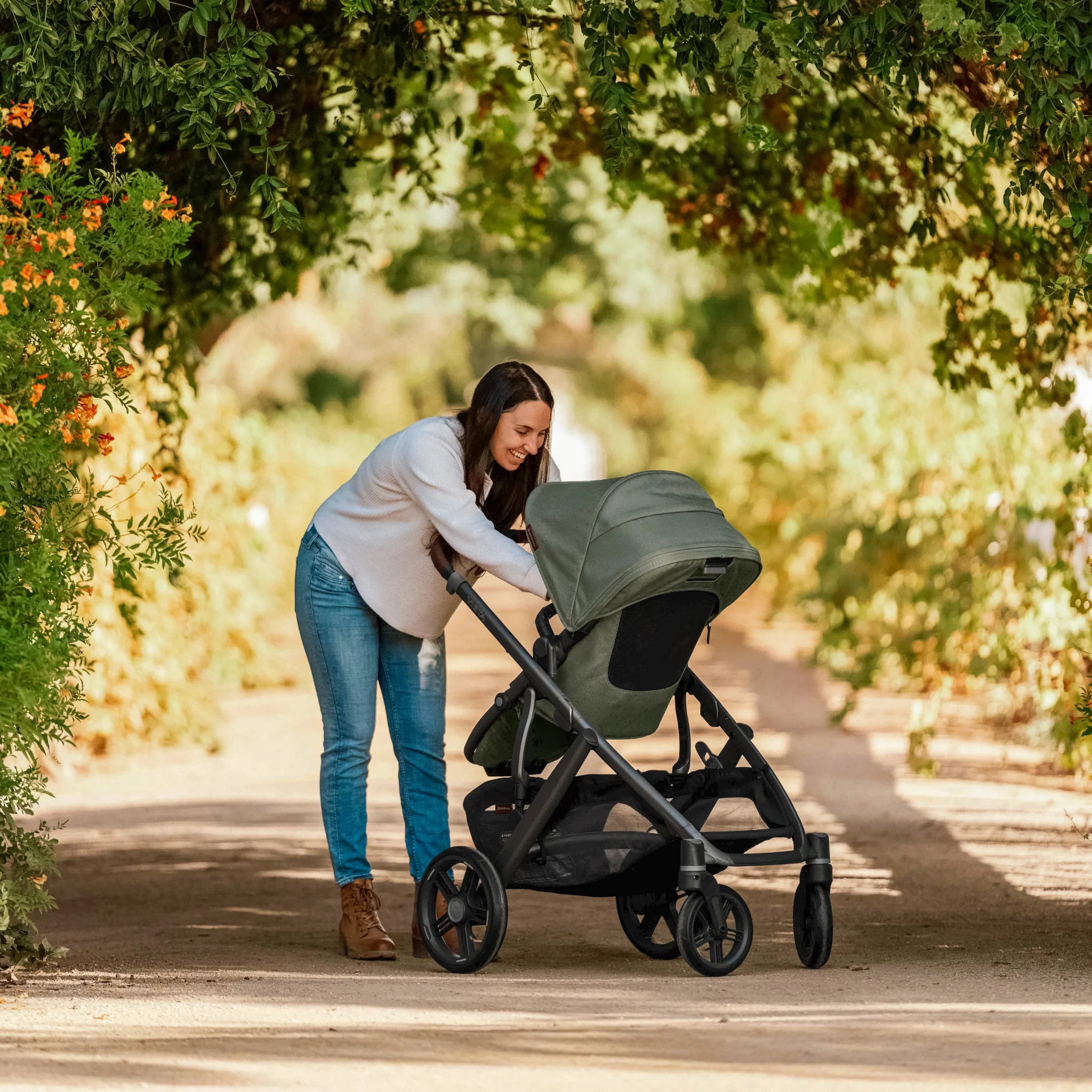 Mum playing with child in Evelyn Vista V3 in forest walkway
