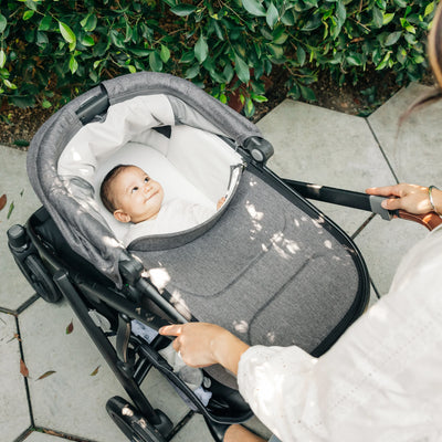 Parents view of smiling baby in Greyson bassinet on Vista.