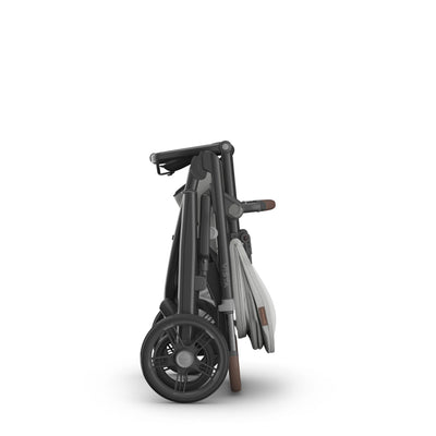 Compact fold of the Vista pram on a white background.