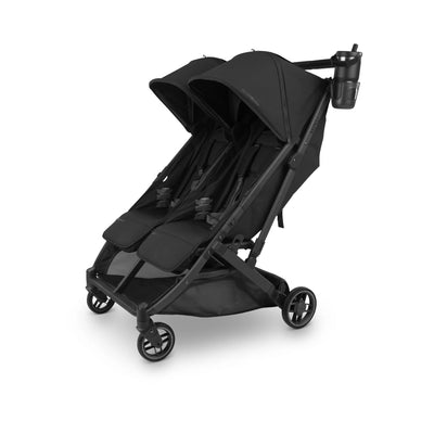 Black double stroller with a cup holder and drink bottle attached, on a white background.