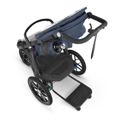 Ridge piggyback board, attached to rigde stroller, on a white background. 