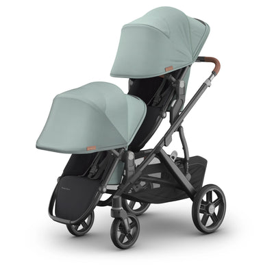 Double rumbleseat in kenzi with sunshade extended on the vista on a white background.